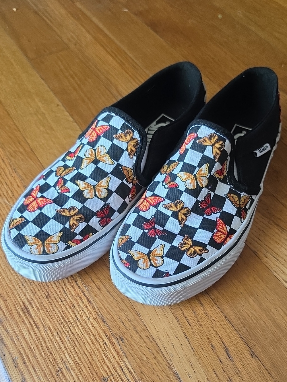 Vans Kids Black & White Checkerboard Slip-Ons with Orange & Red Butterfly Print